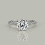 Load and play video in Gallery viewer, Emilia Round Cut Hidden Halo 4 Prong Claw Set Engagement Ring