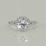 Load and play video in Gallery viewer, Luciana Round Cut Halo Split Shank Claw Set Engagement Ring