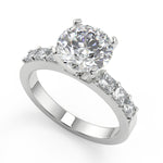 Load image into Gallery viewer, Karsyn Shared Prong Assher Accents 4 Prong Round Diamond Ring - Nivetta
