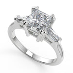 Load image into Gallery viewer, Kiara Baguette Accents 3 Stone Princess Cut Engagement Ring - Nivetta
