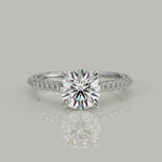 Load and play video in Gallery viewer, Emilia Round Cut Hidden Halo 4 Prong Claw Set Engagement Ring
